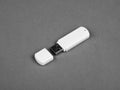 White usb flash drive on gray background Royalty Free Stock Photo