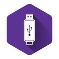 White USB flash drive icon isolated with long shadow. Purple hexagon button