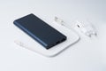 White USB power adapter, cable and blue power bank for divice isolated on a white background Royalty Free Stock Photo