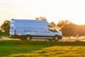 White Van driving fast on a country road. Royalty Free Stock Photo