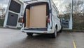 A white van packed with Cardboard boxes