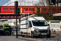 White Van And Traffic Passing Under Railway Bridge With Southern Railway Train On Bridge Royalty Free Stock Photo