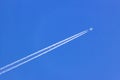 White vapor trail from the jet plane on blue sky Royalty Free Stock Photo