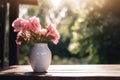 A white vase filled with pink flowers on top of a wooden table. AI generative image. Royalty Free Stock Photo