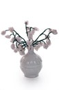 White vase with flowers from glass beads and wire