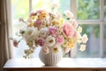 white vase with many beautiful bouquet colored flowers