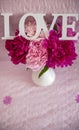 White vase with peonies and Love Royalty Free Stock Photo