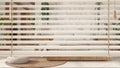 White venetian blinds close up view, over modern kitchen, over bohemian wooden bedroom in boho style. Double bed, interior design Royalty Free Stock Photo