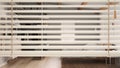 White venetian blinds close up view, over modern wooden bedroom with double bed and walk in closet, interior design, privacy Royalty Free Stock Photo