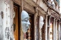 White venetian masks hanging in front of touristic shop in Venice Royalty Free Stock Photo