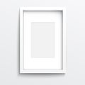 White vertical frame on gray wall.