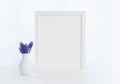 White vertical frame mockup with muscari flowers Royalty Free Stock Photo