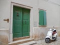 WHITE VESPA AND GREEN DOOR AND WINDOW, ROVINJ, CROATIA Royalty Free Stock Photo