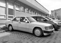 White veteran vintage classic old white sedan car Mercedes Benz 190E parked