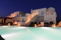 White villas near pool of a luxury resort at night