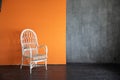 White vintage armchair in grey orange room interior Royalty Free Stock Photo
