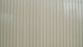 White vintage corrugated metal or zinc texture surface or galvanize steel in the vertical line background or texture