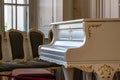 White vintage grand piano in the old living room. vintage interior Royalty Free Stock Photo