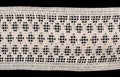 white vintage macrame lace isolated on black