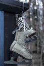 White vintage skates on a Christmas silver defocused background Royalty Free Stock Photo