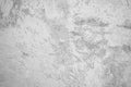 White vintage wall texture. Damaged old plaster on a concrete wall. Light gray rough surface background. Royalty Free Stock Photo