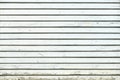 White vintage wooden boards in overlap cladding pattern