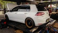 White Volkswagen golf GTI MK 7 on dyno to measure the engine power