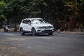 White Volkswagen Tiguan All Space driving fast on the road blurry in motion