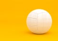 White volleyball isolated on a yellow background Royalty Free Stock Photo