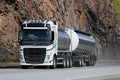 White Volvo FH Tank Truck on Highway with Rock Background Royalty Free Stock Photo