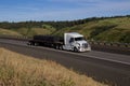 White Volvo / Loaded Semi-Truck Royalty Free Stock Photo