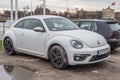 White VW New Beetle parked near ruins Royalty Free Stock Photo