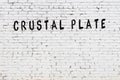 White wall with black paint inscription crustal plate on it Royalty Free Stock Photo