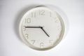 White wall clock isolated on a white background