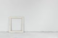 White wall and concrete cement floor, with vintage picture frame Royalty Free Stock Photo