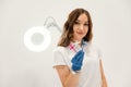 White wall. Cosmetologist holding syringes for injection lips augmentation. Women's cosmetology in the beauty salon