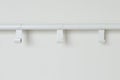 White wall with empty clothes hanger Royalty Free Stock Photo