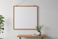 White wall, hanging poster mockup, wooden frame, simple clips, clips, poster mockup Royalty Free Stock Photo