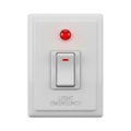 White wall light switch with red indicator light Royalty Free Stock Photo