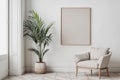 White wall with one empty wooden frame for wall art mockup. Minimalist boho room with beige chair and tropical house plant Royalty Free Stock Photo