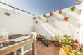 White wall of a terrace with Andalusian-style hanging pots Royalty Free Stock Photo