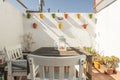 White wall of a terrace with colorful hanging pots in Andalusian style, Royalty Free Stock Photo