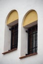 Two twin windows with yellow bow Royalty Free Stock Photo