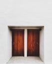 White Wall with Vintage Wood Doors Royalty Free Stock Photo