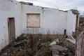 White walls of a partially destroyed building.