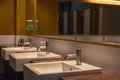 White wash bowl row in modern restroom interior,wash basin background Royalty Free Stock Photo