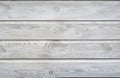 White wash painted texture wooden background of shelves planks with growth rings and wood grain vains