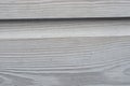 White wash painted texture wooden background of shelves planks with growth rings and wood grain vains