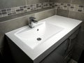 White washbasin with chrome faucet