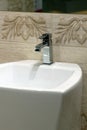 White washbasin and chrome tap Royalty Free Stock Photo